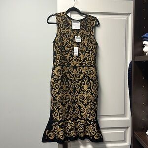 Black and gold jacquard knit moschino couture dress.